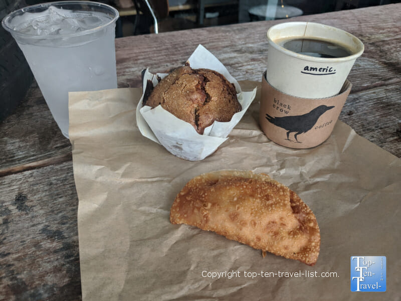 Vegan muffin, mac and cheese empanada, and Americano at The Black Crow coffeeshop in St. Petersburg, Florida 