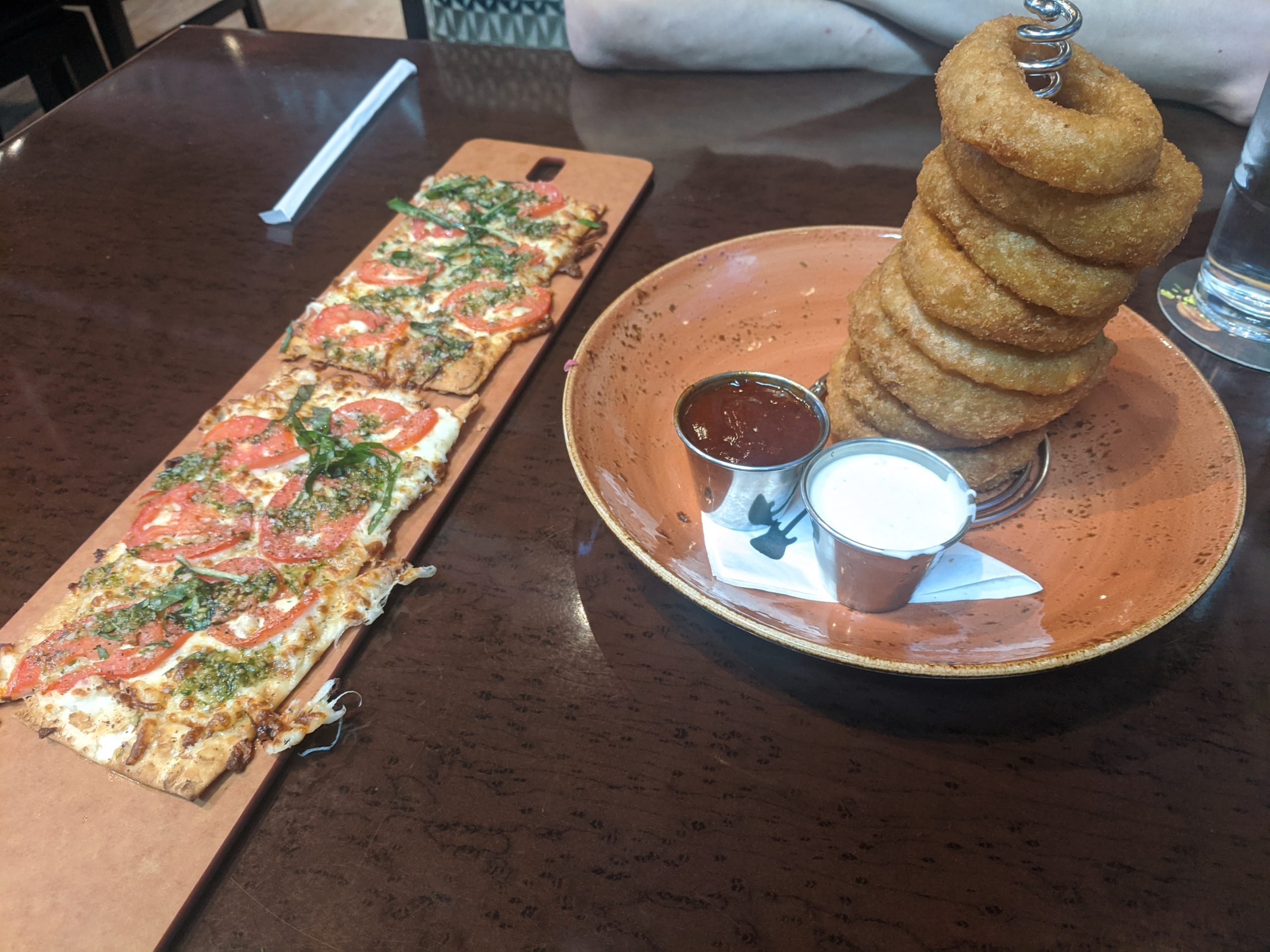 Flatbread and onion ring apps at Hard Rcok