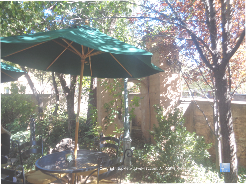 Patio dining area with trees Secret Garden Cafe in Sedona
