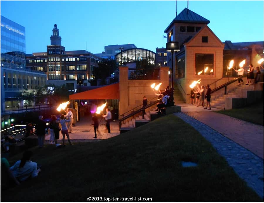 Carrying torches in Waterfire event in downtown Providence 
