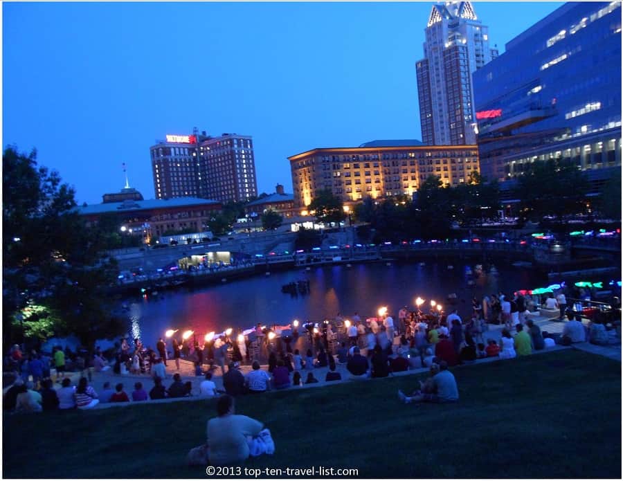 holding torches for the Waterfire event in Providence