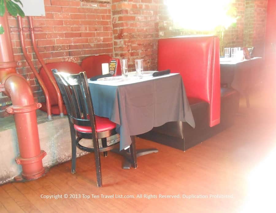 Seating area and exposed brick at Bella Luna in Jamaica Plain