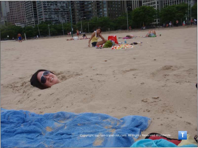 burying myself in the sand at Oak Street Beach