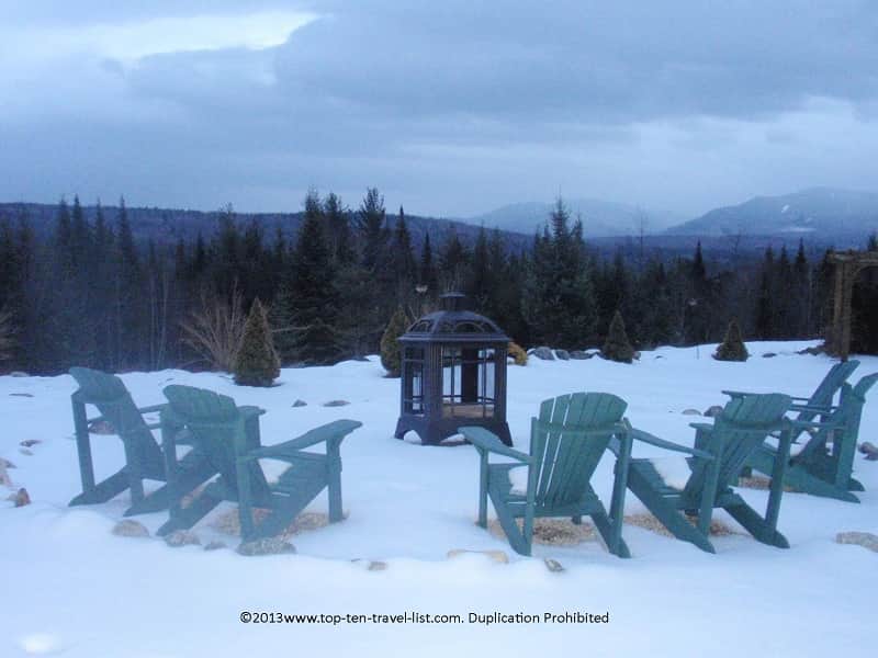 Snowy outdoor fire pit at Bear Mountain Lodge in New Hampshire