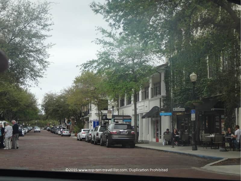A view of the brick streets and beautiful trees lining the Winter Park neighborhood.