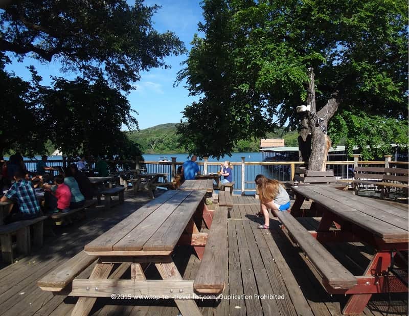 Outdoor patio with lake view at Mozart's Coffee Roasters in Austin