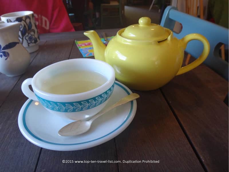 A pot of White Peony tea in a yellow teapot at Copper Kettle Tea Bar in Foley, Alabama