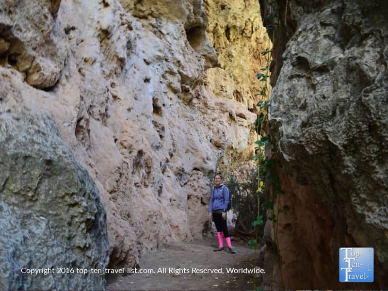 Walking underneath a cave at Tonto Natural Bridge State Park