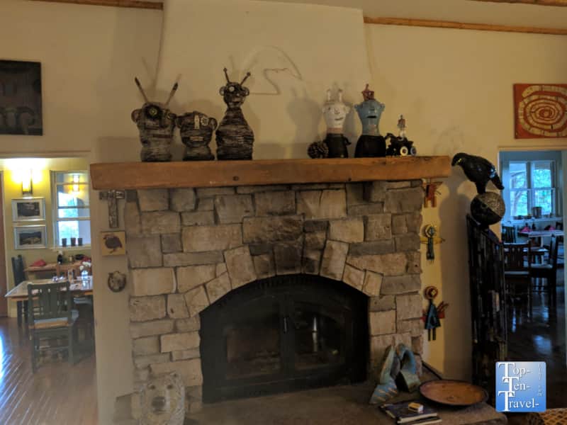 Rustic fireplace and beautiful art work at the Bear Mountain Lodge in Silver City, New Mexico