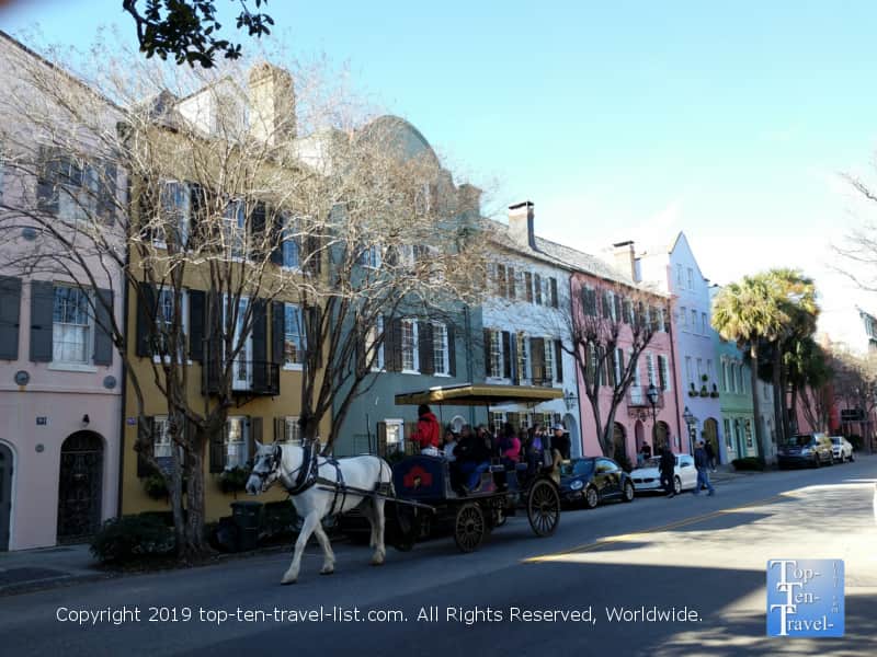 Horse drawn carriage making its' way down historic Rainbow Row in Charleston, South Carolina