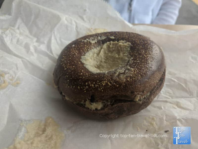 Pumpernickel bagel with hummus at St. Pete Bagel Company in Tampa Bay