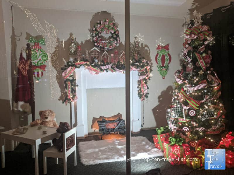 Christmas tree and fireplace window scene in Forest City