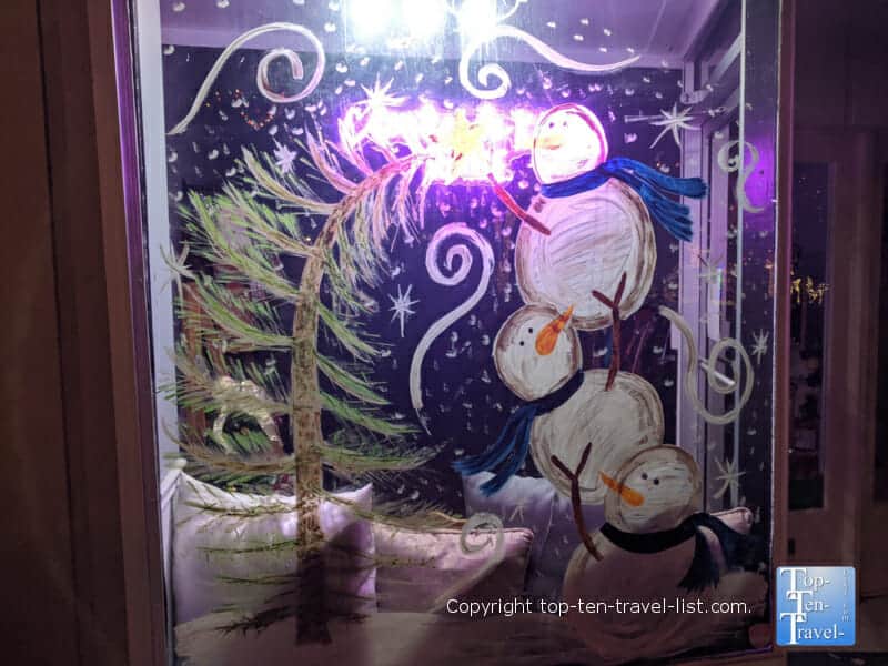 Festive snowman window display in Forest City, North Carolina