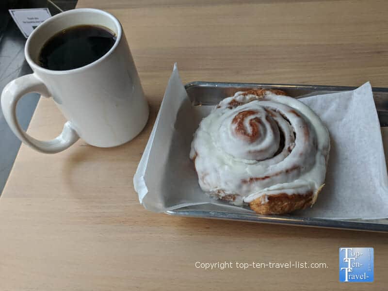 Cinnamon roll and delicious coffee at City Bakery in Asheville, North Carolina 