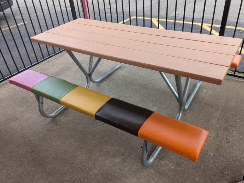 Colorful picnic table at the Original Rainbow Cone in Chicago