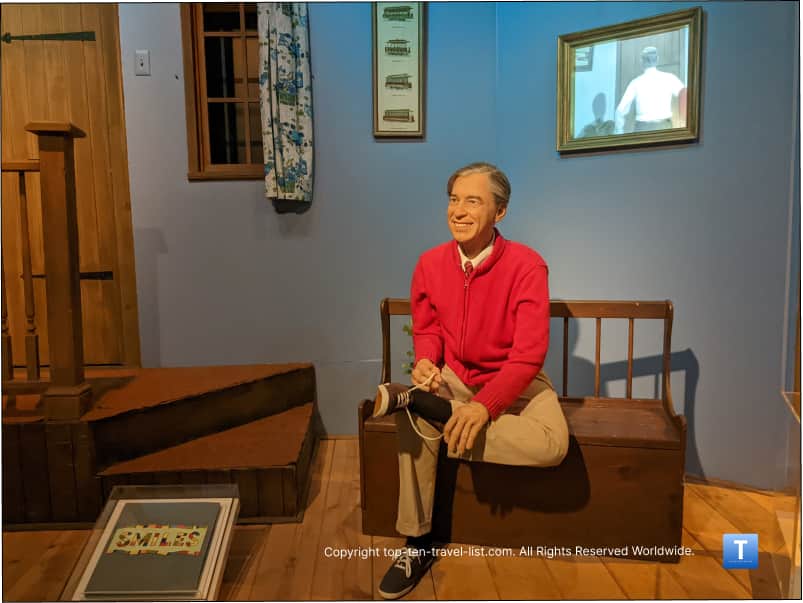 Mr. Rogers tying his shoes at the Heinz History Center