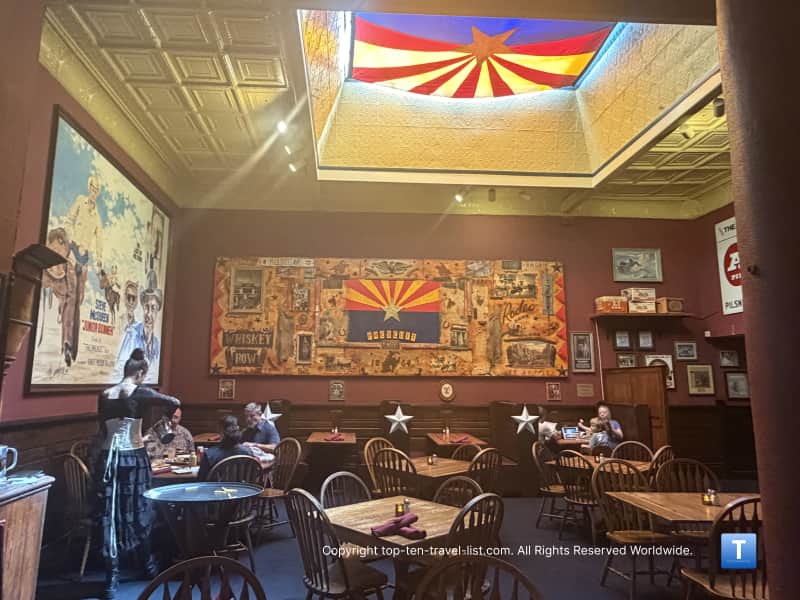 Arizona flag and Western movie poster at The Palace Saloon in Prescott 